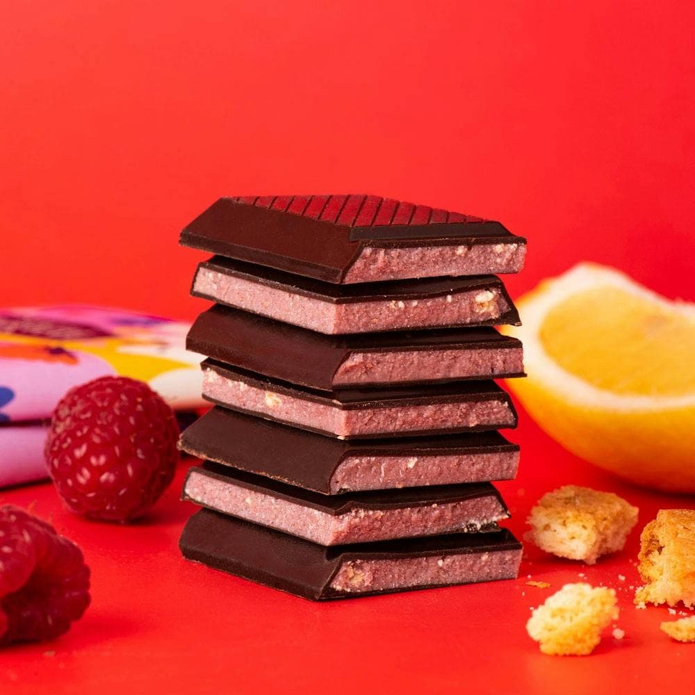 a stack of chocolate with raspberry in the middle